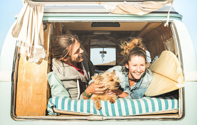 Happy couple in camper van