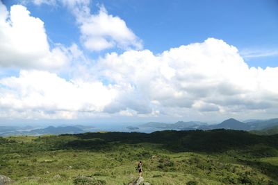 Scenic view of landscape against cloudy sky