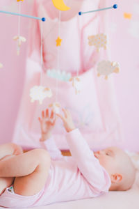 Close-up of baby girl at home