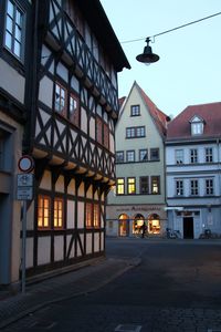 Street amidst buildings against sky