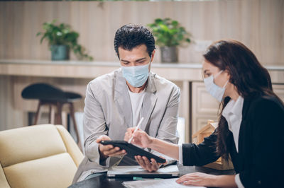 Man and woman using smart phone