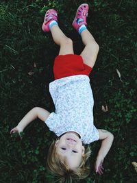 Girl standing on grassy field