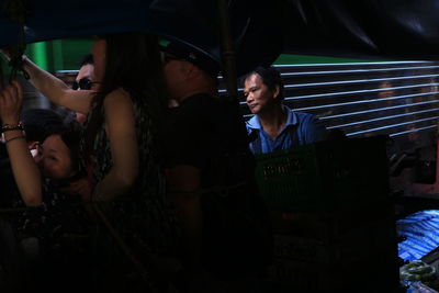 People enjoying music concert at night