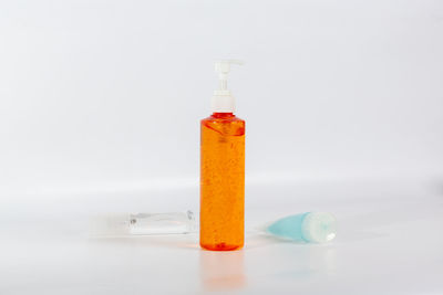 Close-up of bottle on table against white background