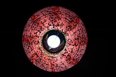 Low angle view of illuminated electric lamp