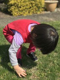 Portrait of cute girl picking flowers 