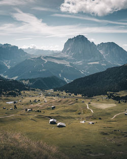 Scenic view of landscape and mountains against sky