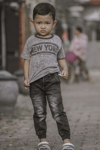 Portrait of boy standing outdoors