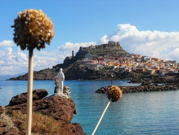 Panoramic view of sea and buildings against sky