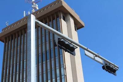 Low angle view of built structure against clear blue sky