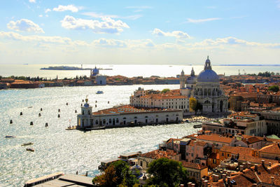 High angle view of santa maria della salute in city by canals