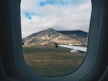 Cropped airplane on landscape