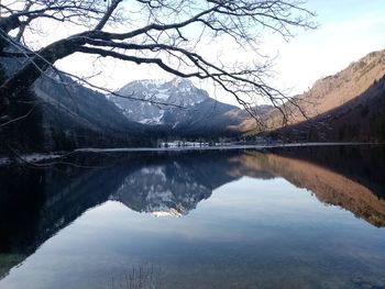 Scenic view of lake and mountains against sky