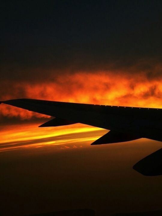airplane, sunset, aircraft wing, transportation, flying, air vehicle, sky, mode of transport, cloud - sky, scenics, beauty in nature, part of, mid-air, cropped, orange color, travel, nature, cloud, journey, tranquility