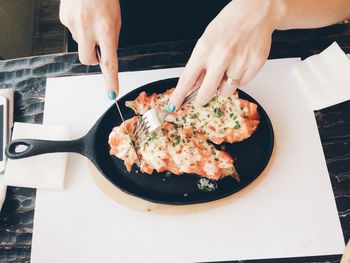 High angle view of hand holding ice cream