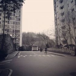 Road along buildings in city