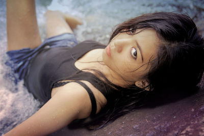 Portrait of beautiful woman resting at beach