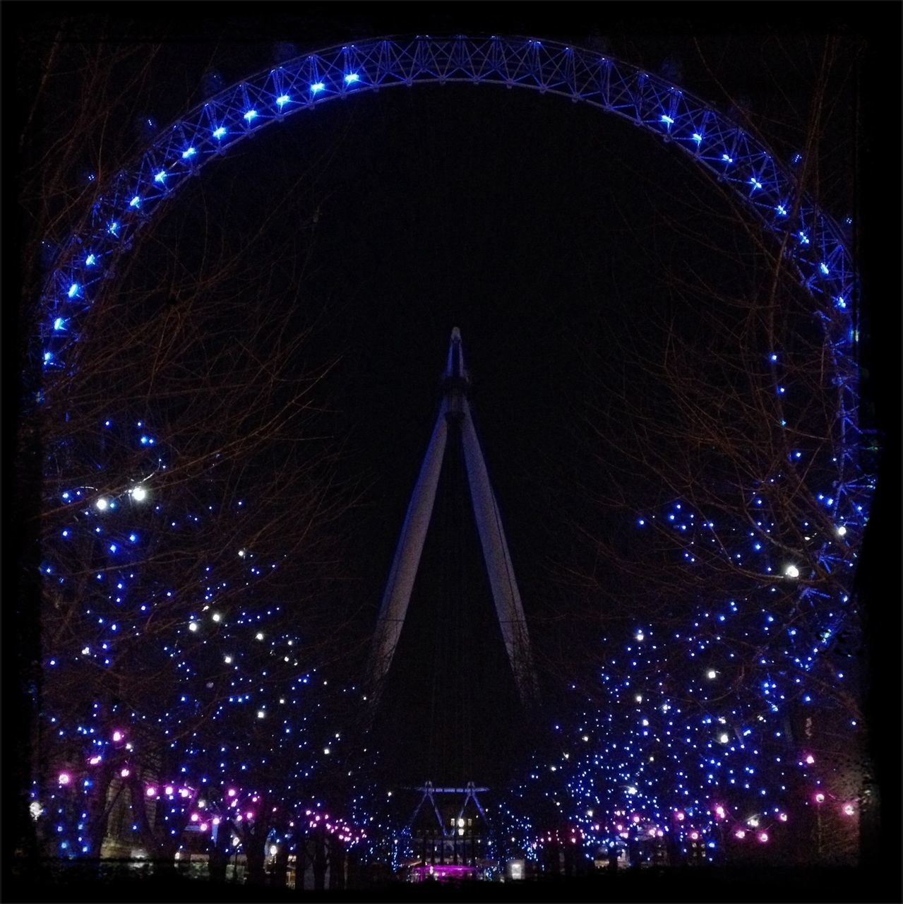 night, illuminated, built structure, architecture, arts culture and entertainment, ferris wheel, travel destinations, amusement park ride, amusement park, famous place, low angle view, tourism, city, international landmark, capital cities, building exterior, long exposure, sky, travel, glowing