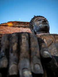 Low angle view of statue against sky