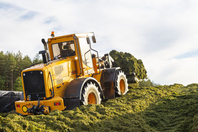 Agricultural machine working at farm