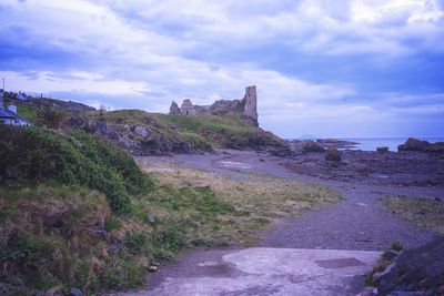 Built structure on land against sky