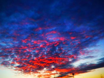 Low angle view of cloudy sky at sunset