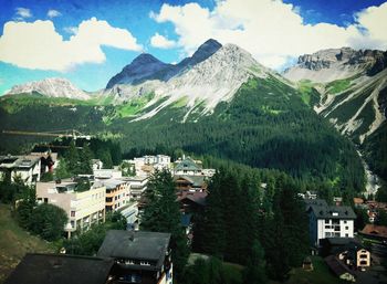 Houses against mountains