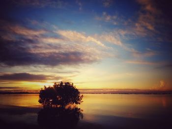 Scenic view of sea against sky at sunset