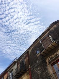 Low angle view of old building against sky