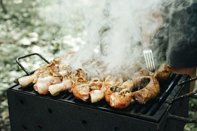 Close-up of meat on barbecue grill