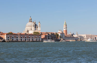 View of cathedral in city against clear sky