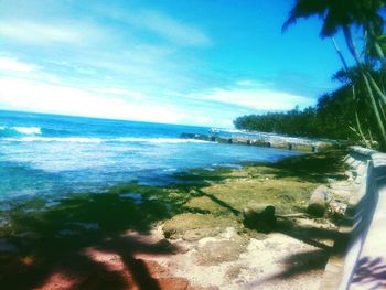 Scenic view of sea against cloudy sky