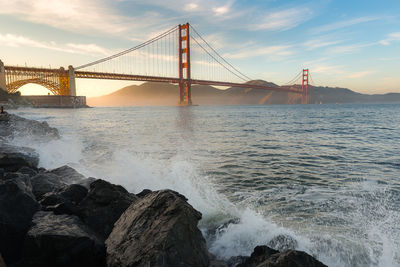 View of suspension bridge over sea