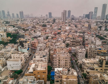 High angle view of buildings in city against sky