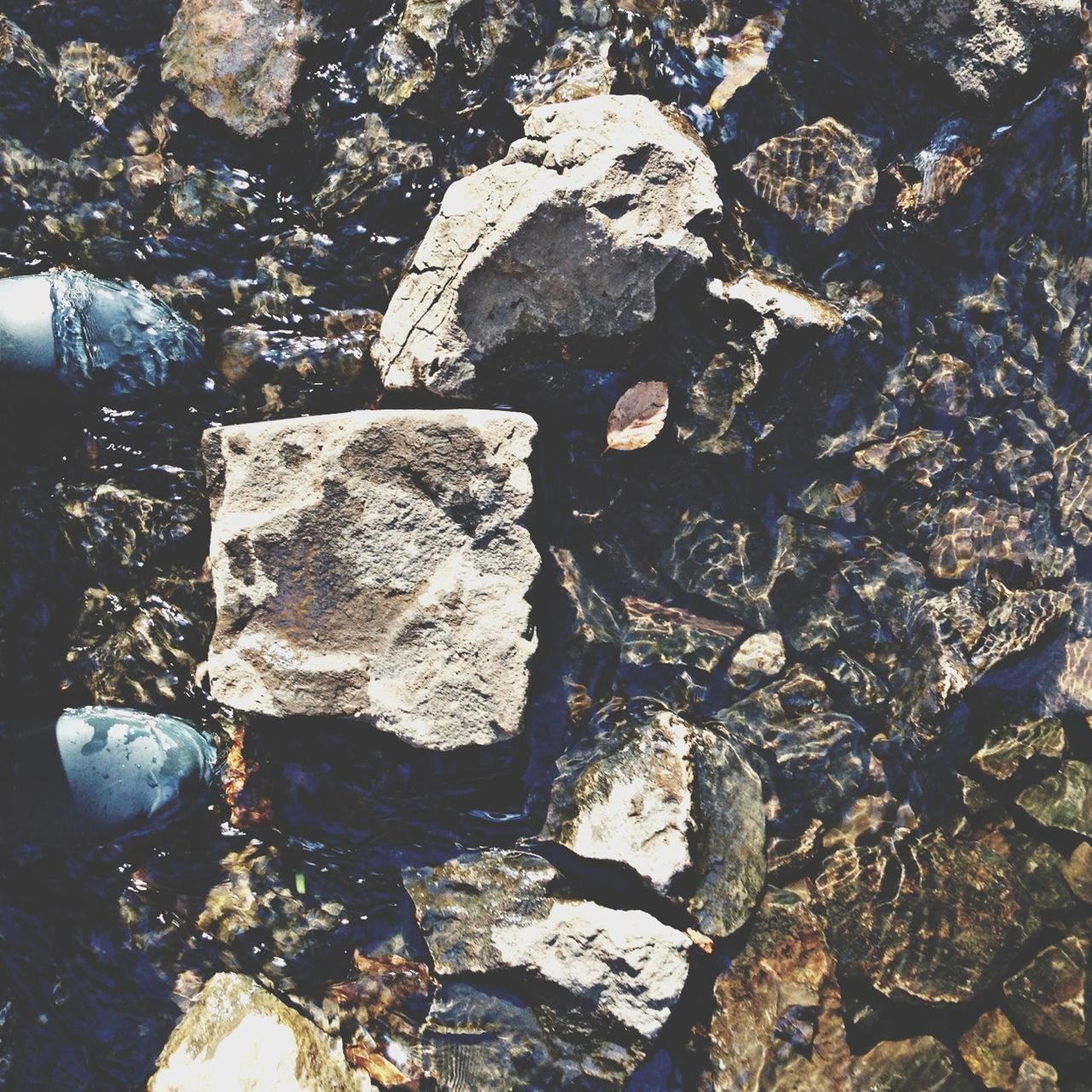 textured, rock - object, rough, backgrounds, full frame, high angle view, close-up, stone - object, damaged, no people, weathered, nature, day, outdoors, sunlight, pattern, abandoned, cracked, stone, old