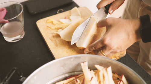 Midsection of person preparing food