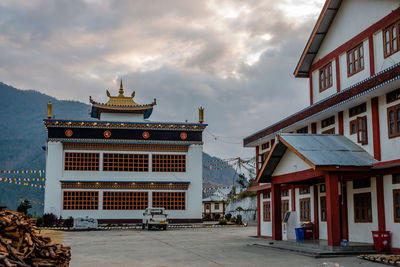 View of buildings against cloudy sky