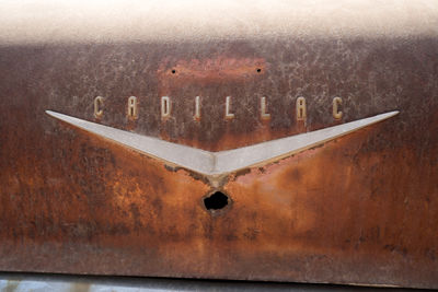 Close-up of text on rusty metal