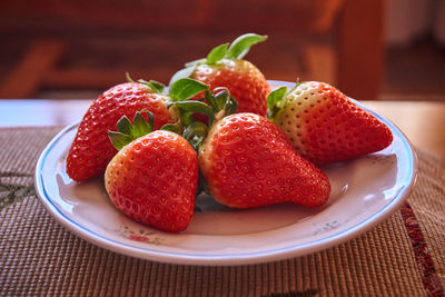 Close-up of strawberries in plate on table