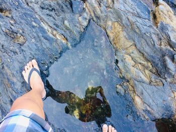 Low section of person on rock