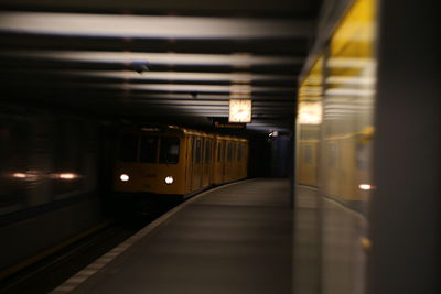 Train at railroad station at night