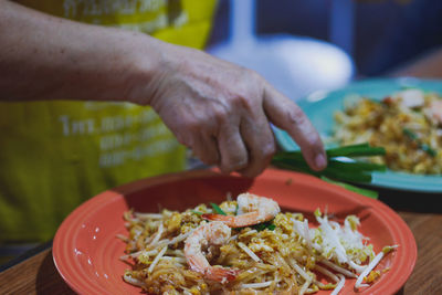 Close-up of person preparing food