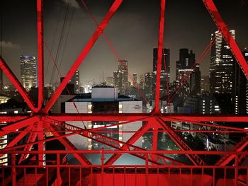 View of illuminated buildings against sky at night