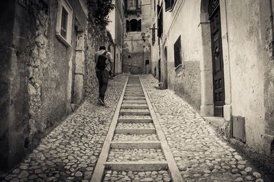 Narrow alley with buildings in background