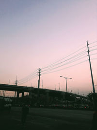 Silhouette city against sky during sunset