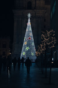 Illuminated christmas tree at night