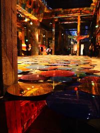 Illuminated table in city at night