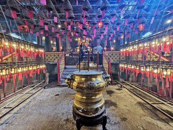 Illuminated lanterns by building at night