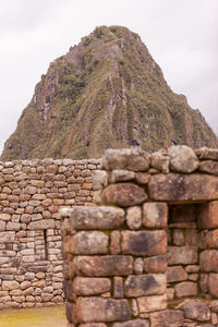 Stone wall against brick wall