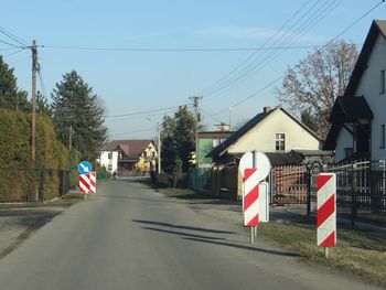 Road amidst buildings against sky in city